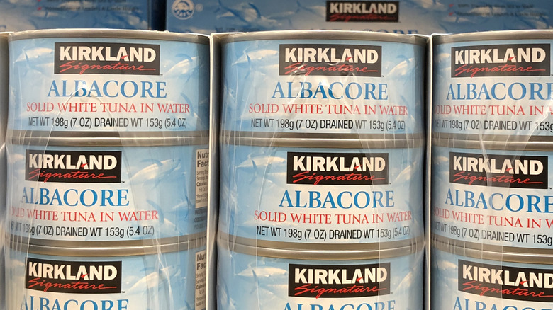 Kirkland Signature Albacore canned tuna stacked in plastic wrapping