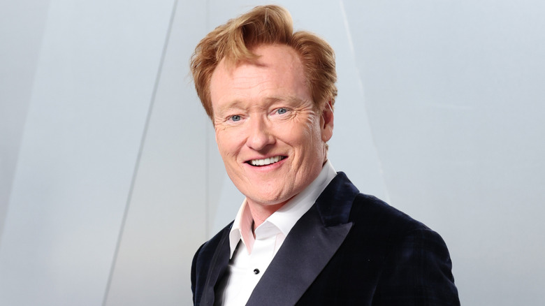 Conan O'Brien in a tux smiling at the camera