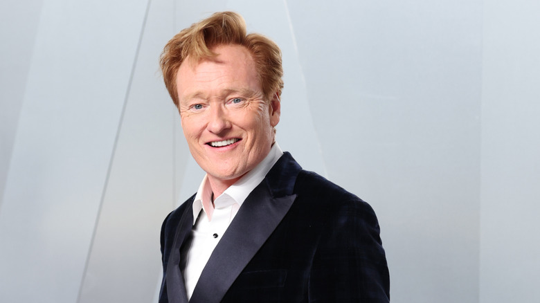 Conan O'Brien in a tux smiling at the camera