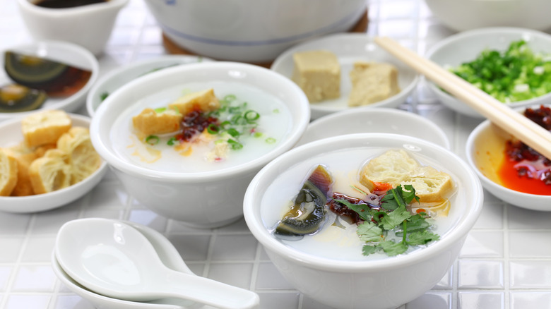 Bowls of congee with topping