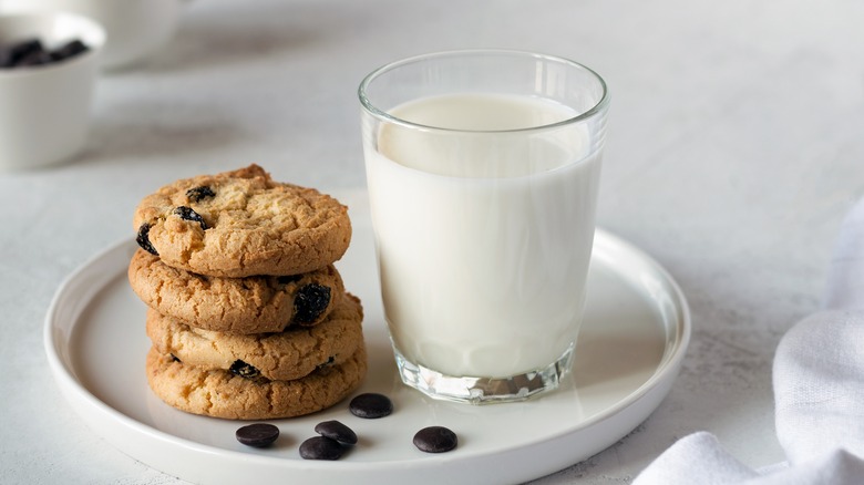 Stack of chocolate chip cookies and glass of milk