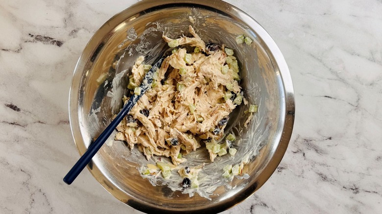 Chicken salad mixed in bowl