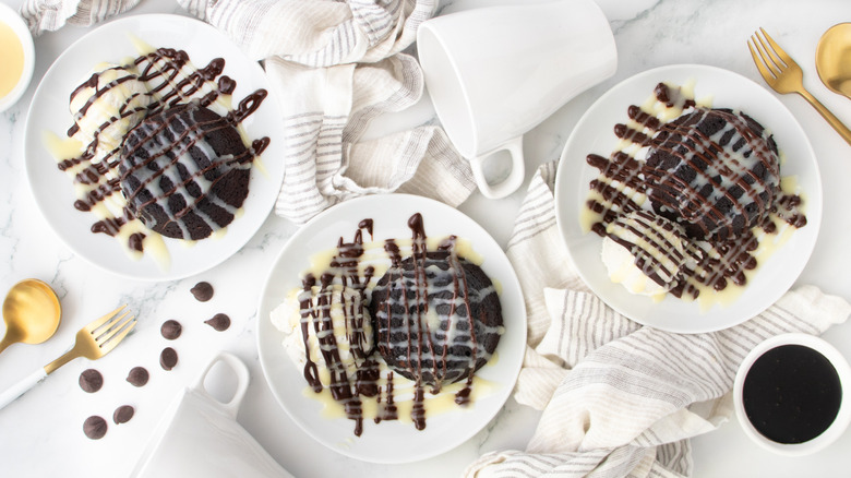 chocolate lava cakes with vanilla ice cream and chocolate sauce