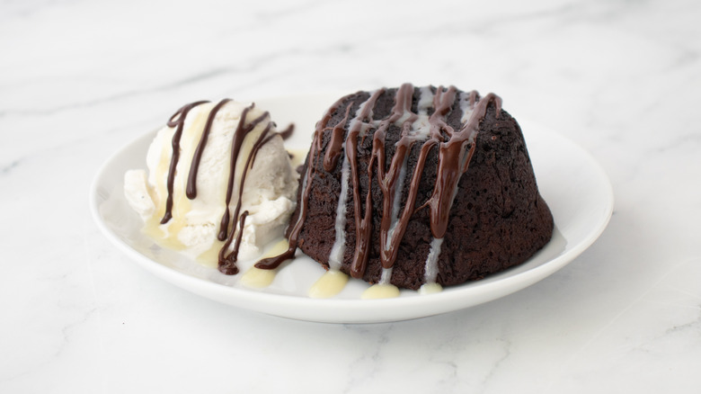 chocolate lava cake with vanilla ice cream and chocolate sauce