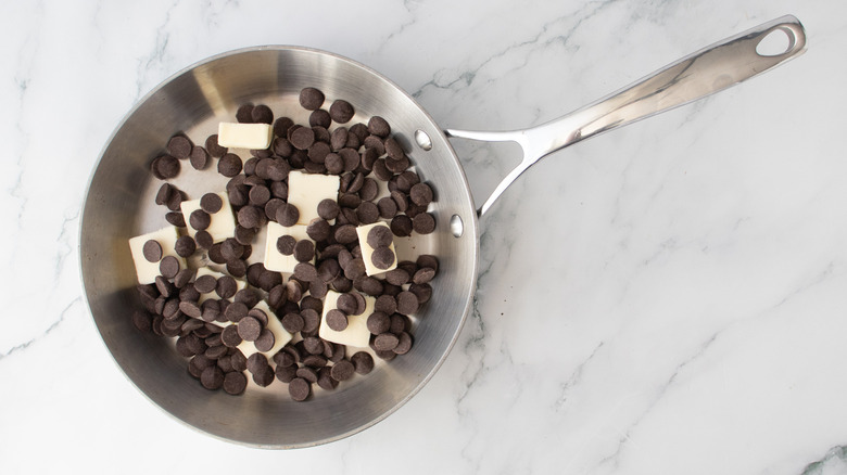 chocolate chips and butter in a metal frying pan