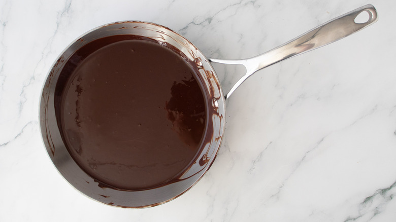 melted chocolate in a metal frying pan