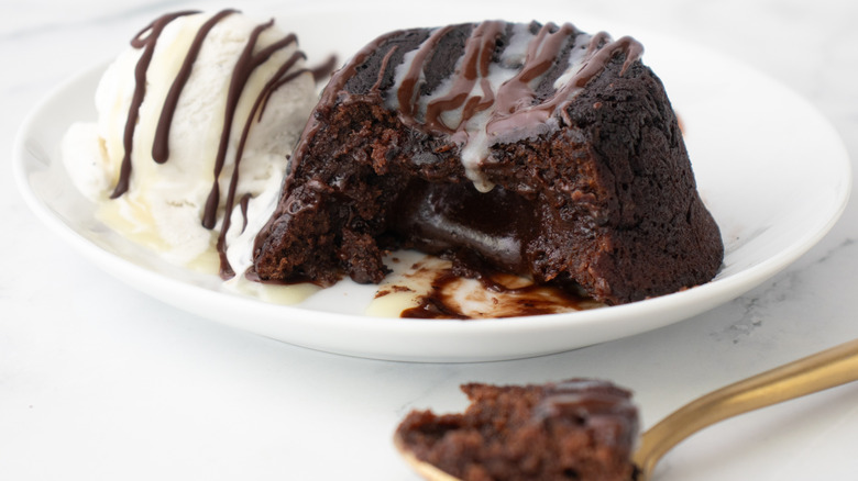 chocolate lava cake with vanilla ice cream and chocolate sauce