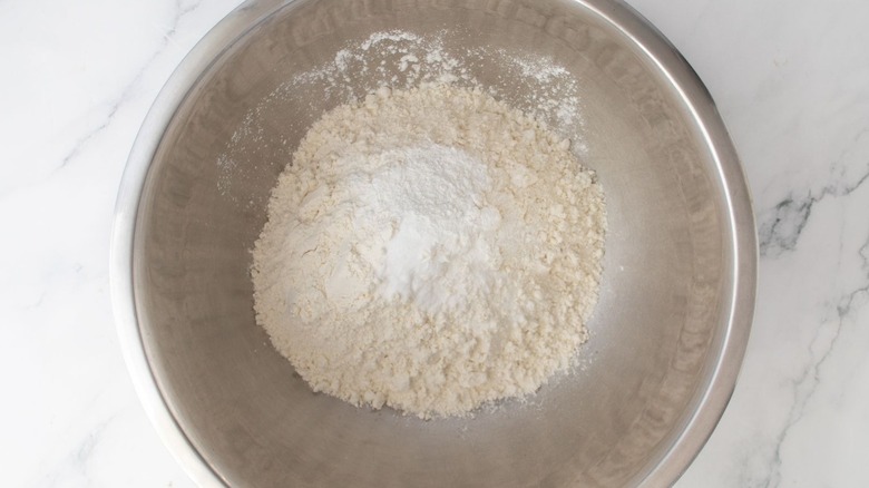Flour and baking powder in mixing bowl