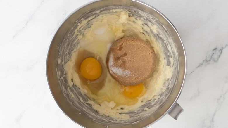 Creamed butter, brown sugar, and eggs in mixing bowl