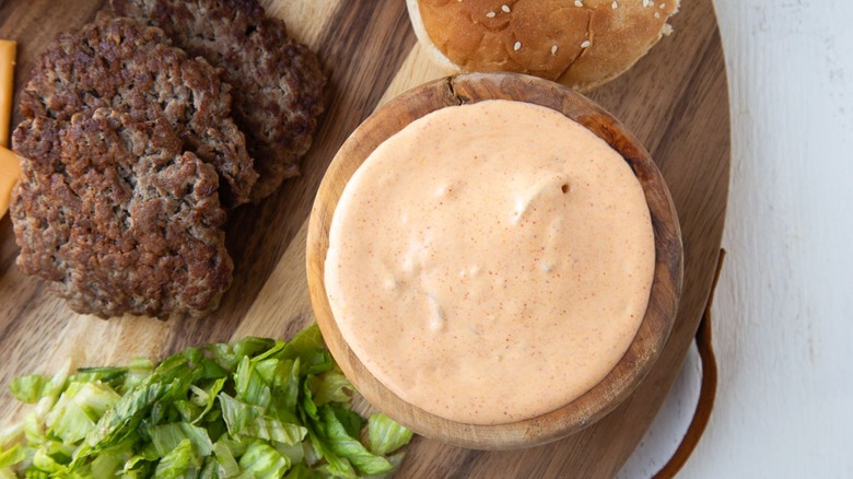 big mac sauce in bowl with burger patties