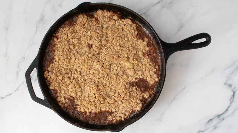 oat mixture in a black frying pan