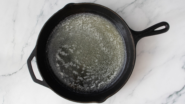 melted butter in a black frying pan