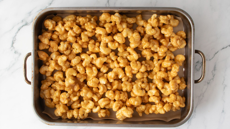 Caramel coated puffcorn in roasting pan