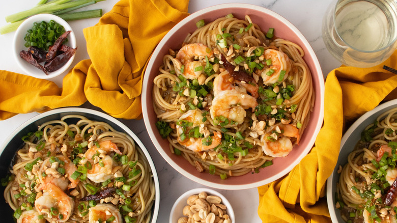 Kung pao spaghetti with shrimp served in bowls