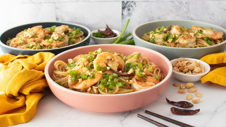 Kung pao spaghetti with shrimp served in bowls