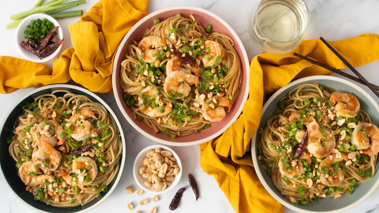 Bowls of kung pao spaghetti with shrimp