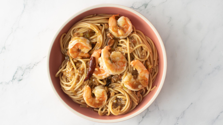 Kung pao spaghetti with shrimp in bowl