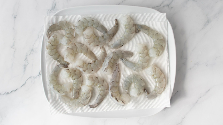 Raw shrimp on paper towels