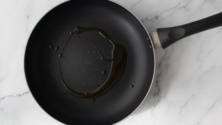Drizzle of oil in skillet