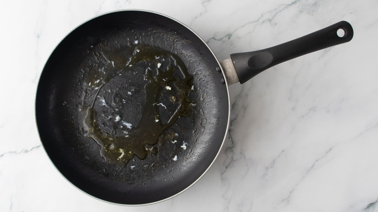 Drizzle of oil in pan