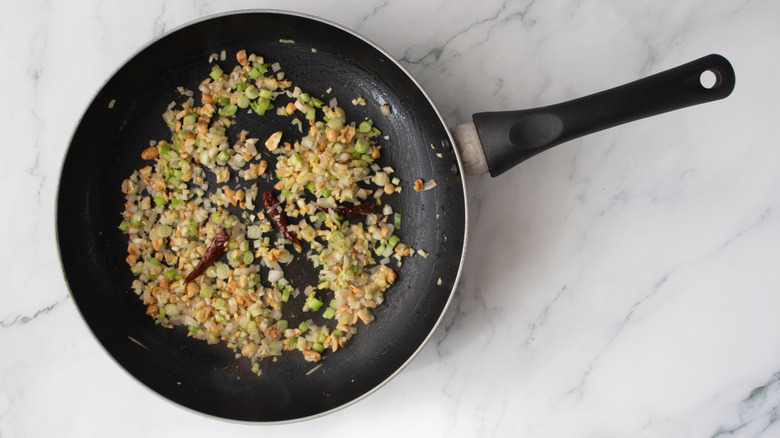 Sauteed aromatics in pan