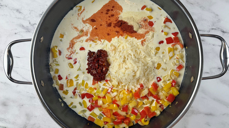 spices and white liquid in a pot