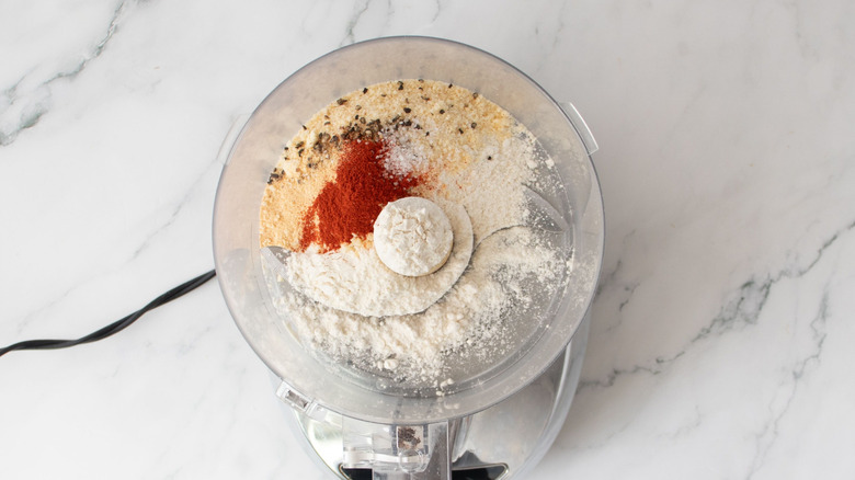 Flour and seasonings in food processor