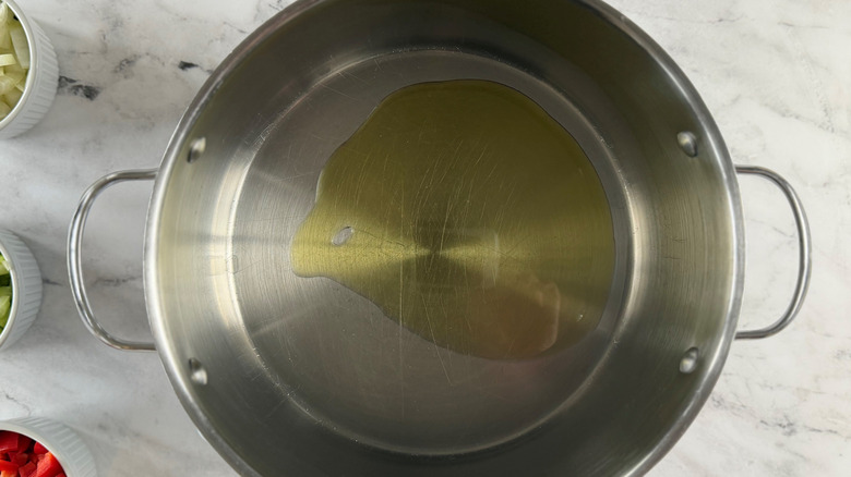 Drizzle of oil in soup pot