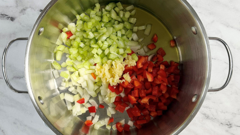 Various diced veggies in soup pot