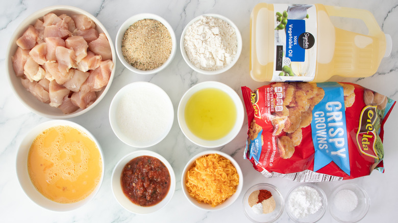 frozen potatoes, raw chicken, eggs, cheese, oil, and seasonings