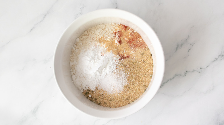seasonings and flour in a white bowl