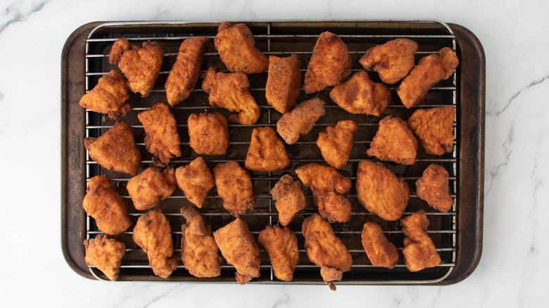 fried chicken nuggets in a pan