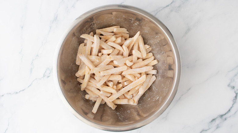 Cornstarch coated fries in bowl