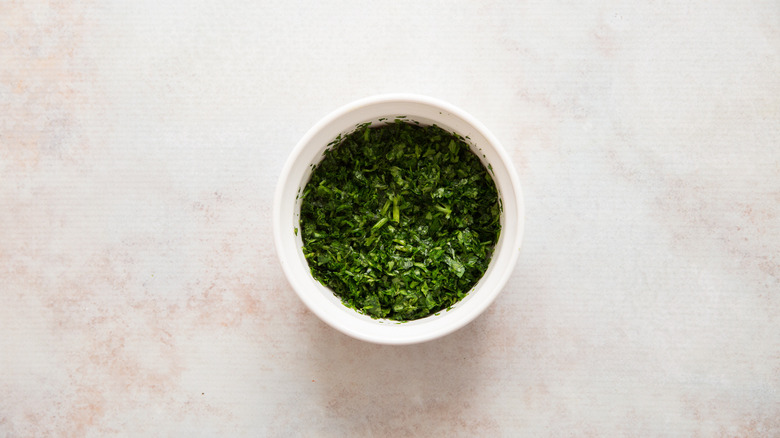 chopped herbs in small bowl