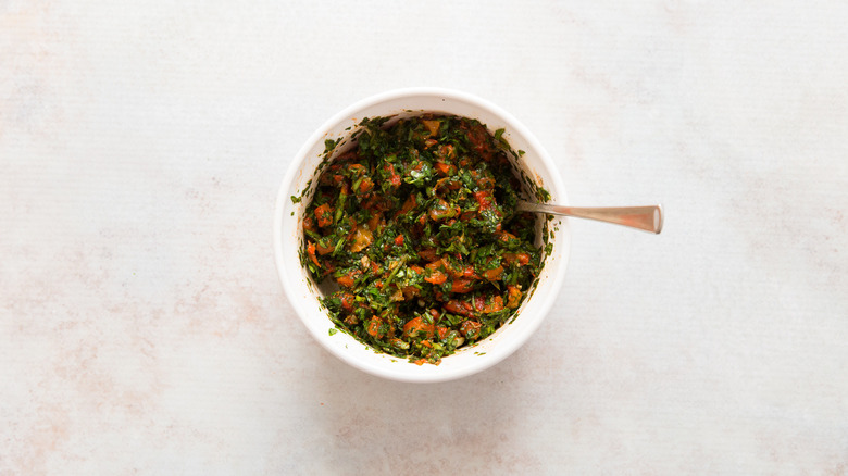 chimichurri in small white bowl