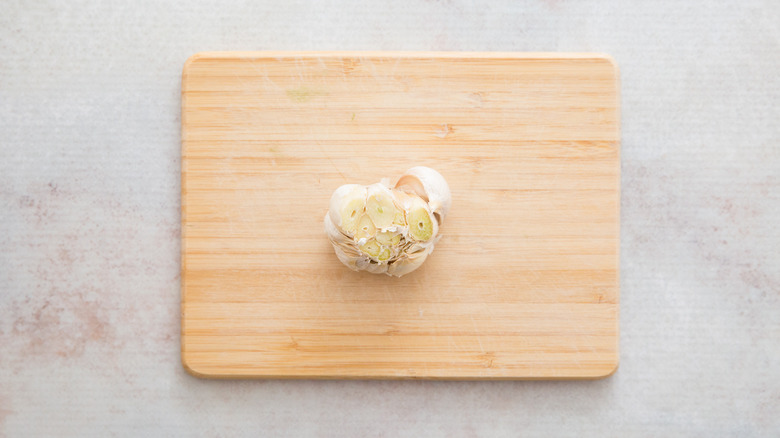 garlic head sitting on board