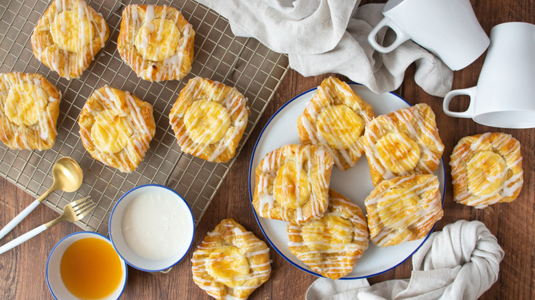 Cream cheese danishes on wire rack and plate