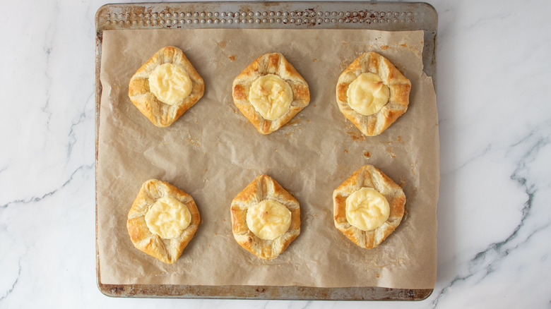 Cream cheese danishes on baking sheet
