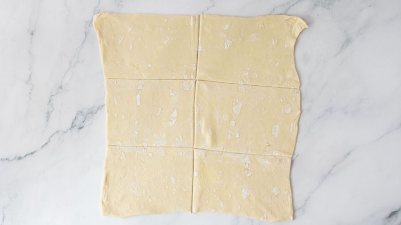 Puff pastry sheet sliced into squares