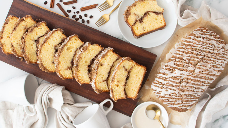 Coffee cake slices next to full coffee cake