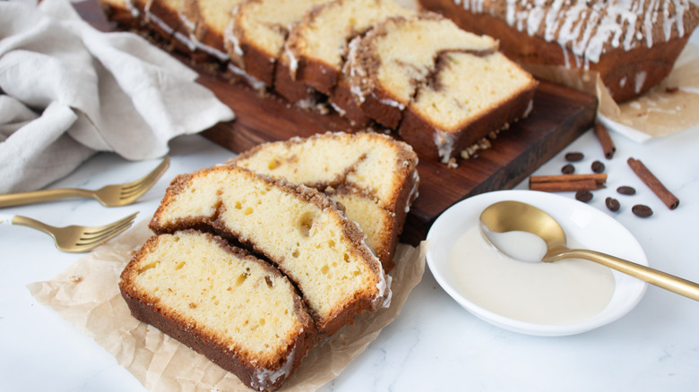 Coffee cake slices next to icing in bowl