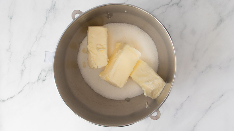 Sugar and butter in mixing bowl
