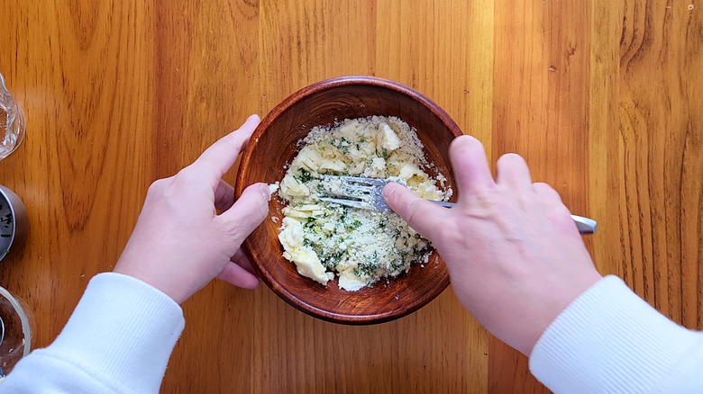 hands mashing butter mixture