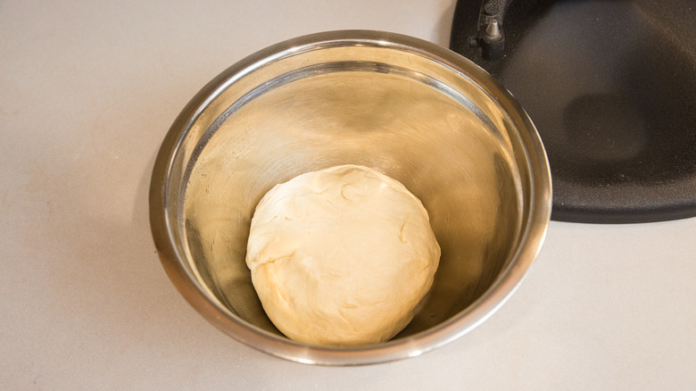 dough ball in metal bowl
