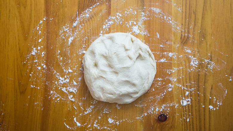 deflated dough ball on table