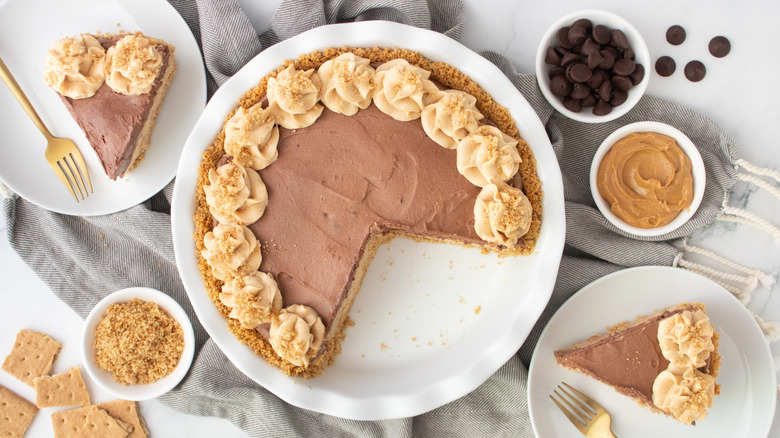 Chocolate peanut butter mousse pie with slices on plates
