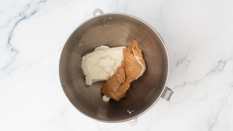 Cream cheese and peanut butter in mixing bowl