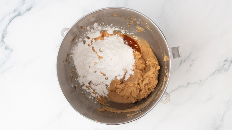 Powdered sugar and peanut butter in mixing bowl