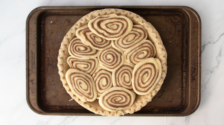 Cinnamon rolls pressed into pie crust
