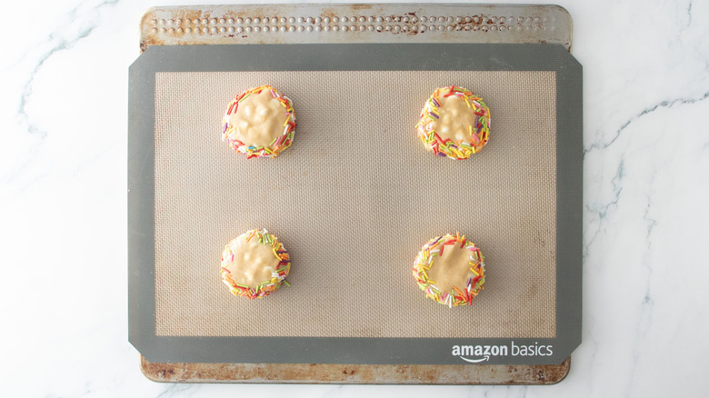 Sprinkle cookie dough balls on cookie sheet